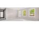 Bright living room featuring hardwood floors, fresh paint, and natural light at 2529 Ryne St, Atlanta, GA 30318