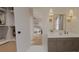 Bathroom view with open closet, modern vanity, and a glimpse into a bright bedroom creating a seamless and stylish transition at 324 Treble Way, Alpharetta, GA 30009