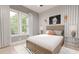 This modern bedroom features a large bed, striped wallpaper, and basketball decor creating a fun and energetic space at 324 Treble Way, Alpharetta, GA 30009
