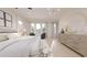 Spacious bedroom with soft lighting, comfortable seating, and a large dresser providing a luxurious and relaxing retreat at 324 Treble Way, Alpharetta, GA 30009