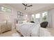 Bright bedroom with large windows, comfortable seating, and a soft color palette creating a serene and inviting space at 324 Treble Way, Alpharetta, GA 30009