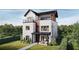 Striking three-story home featuring a modern design, balcony, and a well-manicured lawn at 324 Treble Way, Alpharetta, GA 30009