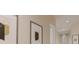 Bright hallway with modern art creating a stylish transition space between rooms at 324 Treble Way, Alpharetta, GA 30009