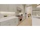 Gourmet kitchen featuring a range, sleek cabinetry, a backsplash, and countertop space at 324 Treble Way, Alpharetta, GA 30009