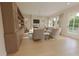 Comfortable living room with hardwood floors, ample seating, a fireplace, and large windows at 324 Treble Way, Alpharetta, GA 30009