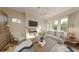 Inviting living room with a fireplace, comfortable sofa, natural light, and hardwood floors at 324 Treble Way, Alpharetta, GA 30009