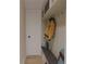 Functional mudroom with hooks, a bench, storage shelves, and a convenient door at 324 Treble Way, Alpharetta, GA 30009