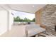 Cozy patio with a stone fireplace, comfortable seating, and lush greenery creating a serene outdoor retreat at 324 Treble Way, Alpharetta, GA 30009