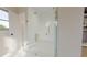 Modern shower with glass door, gold accents, and tile creating a stylish and functional space at 324 Treble Way, Alpharetta, GA 30009