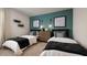 Comfortable twin beds feature stylish decor and a calming color scheme for a serene and inviting atmosphere at 4960 Jatoba Rd, Acworth, GA 30101
