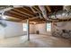 Unfinished basement with exposed beams, concrete floor, and a bicycle at 1866 Tiger Flowers Nw Dr, Atlanta, GA 30314