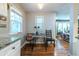 Bright eat-in kitchen featuring hardwood floors, granite countertops, and natural light from two windows at 1866 Tiger Flowers Nw Dr, Atlanta, GA 30314