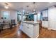 Stylish kitchen with a granite island, pendant lighting, and open access to the living area at 1866 Tiger Flowers Nw Dr, Atlanta, GA 30314