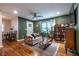 Inviting living room featuring hardwood floors, modern lighting, and comfortable seating at 1866 Tiger Flowers Nw Dr, Atlanta, GA 30314