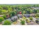 Scenic aerial view of the home in a lush, green, tree-lined neighborhood at 2625 Blackstock Dr, Cumming, GA 30041
