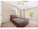 Bedroom featuring carpet, two windows, and a bed frame at 2625 Blackstock Dr, Cumming, GA 30041