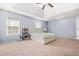 Bright bedroom with large windows and natural light, featuring a spacious layout and carpeted floors at 2625 Blackstock Dr, Cumming, GA 30041