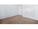 A cozy carpeted bedroom with two white doors and light blue walls at 2625 Blackstock Dr, Cumming, GA 30041