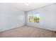 Bright bedroom featuring a large window and carpeted floor at 2625 Blackstock Dr, Cumming, GA 30041