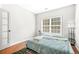 Bedroom with hardwood flooring, a window, and neutral accents at 2625 Blackstock Dr, Cumming, GA 30041