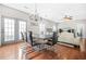 A dining room with a modern chandelier, dark wood table, and plenty of space for entertaining at 2625 Blackstock Dr, Cumming, GA 30041