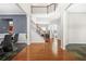 Open foyer features hardwood floors, elegant staircase, and natural light at 2625 Blackstock Dr, Cumming, GA 30041