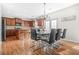 An open kitchen with wood cabinets, granite countertops, stainless appliances, and a breakfast bar seating area at 2625 Blackstock Dr, Cumming, GA 30041