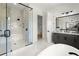 Spa-like bathroom features glass shower with marble tile, soaking tub, and dual sink vanity at 326 Treble Way, Alpharetta, GA 30009