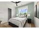 Inviting bedroom features a comfortable bed, walk in closet, and a sunny window view at 326 Treble Way, Alpharetta, GA 30009