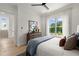 Cozy bedroom with a large window showcasing a lush green view and modern décor at 326 Treble Way, Alpharetta, GA 30009