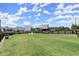 Large fenced dog park with lush green grass for dogs to roam and socialize in a pet-friendly neighborhood at 326 Treble Way, Alpharetta, GA 30009