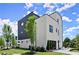 Modern two-story home with striking black and white exterior, lush landscaping, and eye-catching curb appeal at 326 Treble Way, Alpharetta, GA 30009
