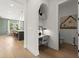 Bright hallway featuring a study nook and a half bathroom at 326 Treble Way, Alpharetta, GA 30009