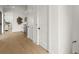 Bright hallway leads to a stylish bar area complete with modern decor and hardwood floors at 326 Treble Way, Alpharetta, GA 30009