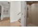 Hallway featuring a home elevator, bright white walls, and light hardwood flooring at 326 Treble Way, Alpharetta, GA 30009