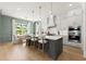 Open kitchen featuring a large island with seating and modern stainless steel appliances at 326 Treble Way, Alpharetta, GA 30009
