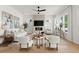 Bright living room with a modern fireplace, hardwood floors, stylish decor, and comfortable seating at 326 Treble Way, Alpharetta, GA 30009
