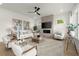 Cozy living room featuring a modern fireplace, stylish decor, hardwood floors, and comfortable seating at 326 Treble Way, Alpharetta, GA 30009