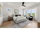 Spacious main bedroom with bright windows, modern decor, and a comfortable seating area at 326 Treble Way, Alpharetta, GA 30009