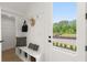 A functional mudroom with built-in bench, storage and access to the outdoors at 326 Treble Way, Alpharetta, GA 30009