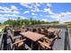 Outdoor community seating and garden with tables and chairs offer a relaxing atmosphere for residents to unwind at 326 Treble Way, Alpharetta, GA 30009