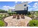 Community outdoor seating area with comfortable chairs and natural stone paving for relaxation and gathering at 326 Treble Way, Alpharetta, GA 30009