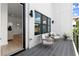 Relaxing outdoor patio with modern seating, sleek black railings, and ample natural light at 326 Treble Way, Alpharetta, GA 30009