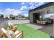Multi-use rooftop terrace featuring lounge area with fireplace, seating, turf, and a dining area with neighborhood views at 326 Treble Way, Alpharetta, GA 30009