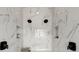 Modern shower with white marble tile, dual shower heads, and convenient built-in shelving at 326 Treble Way, Alpharetta, GA 30009