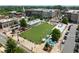 Aerial view of the community with a central green space, restaurants, and shops at 435 Mezzo Ln # 86, Alpharetta, GA 30009