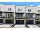 Modern townhomes feature black accents, balconies, and garage entrances for contemporary living at 435 Mezzo Ln # 86, Alpharetta, GA 30009