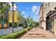 Attractive street view with well-maintained landscaping and storefronts at Avalon community at 435 Mezzo Ln # 86, Alpharetta, GA 30009
