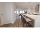 Kitchen with hardwood floors, stainless steel appliances, a large island, and pendant lighting at 435 Mezzo Ln # 86, Alpharetta, GA 30009