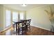 Bright dining area with hardwood floors and natural light streaming through the windows at 701 Monticello Ln, Mcdonough, GA 30253